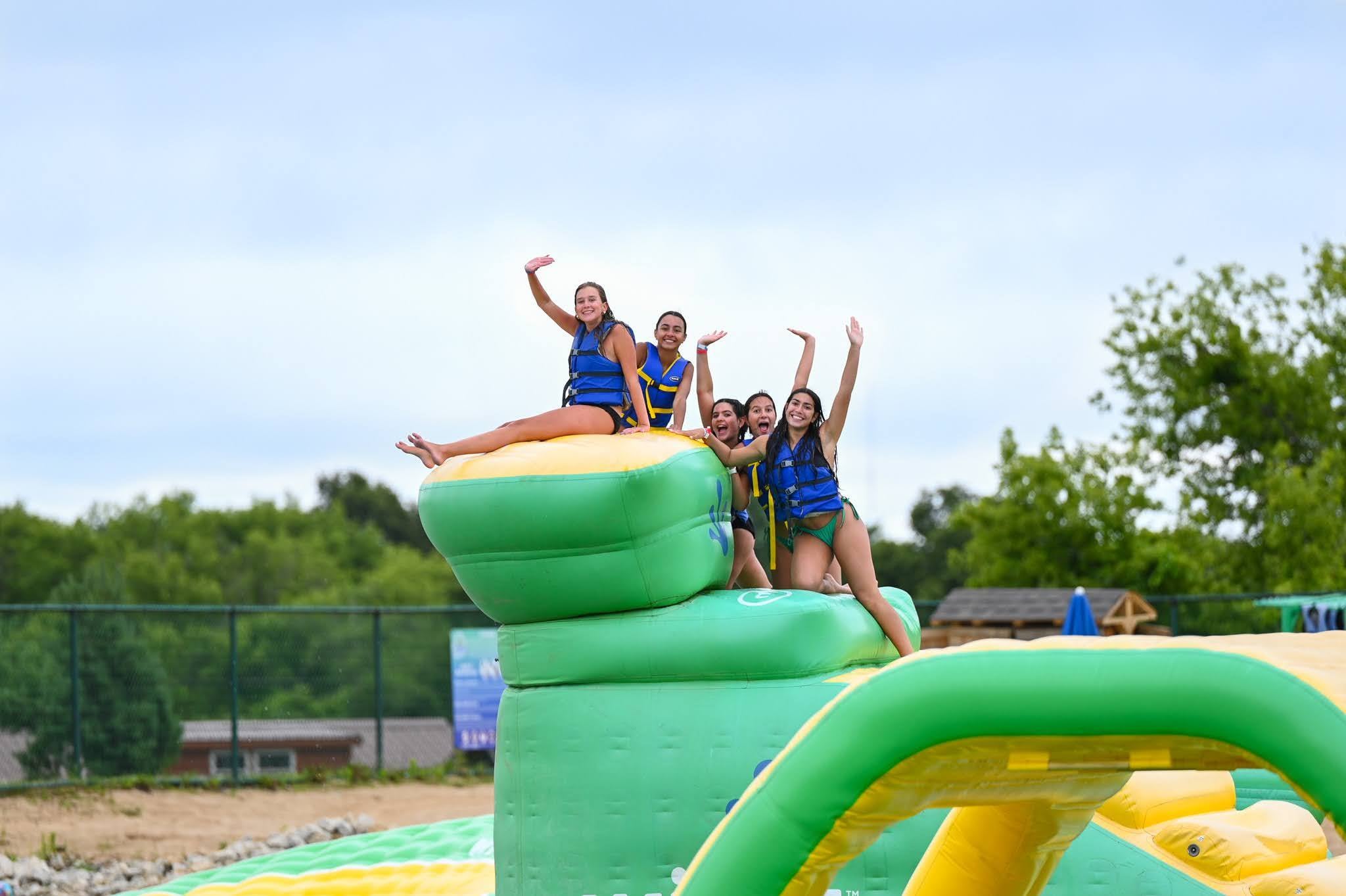 Group of girls enjoying Adventure Island on a warm summer day at Bear Paw Adventure Park.